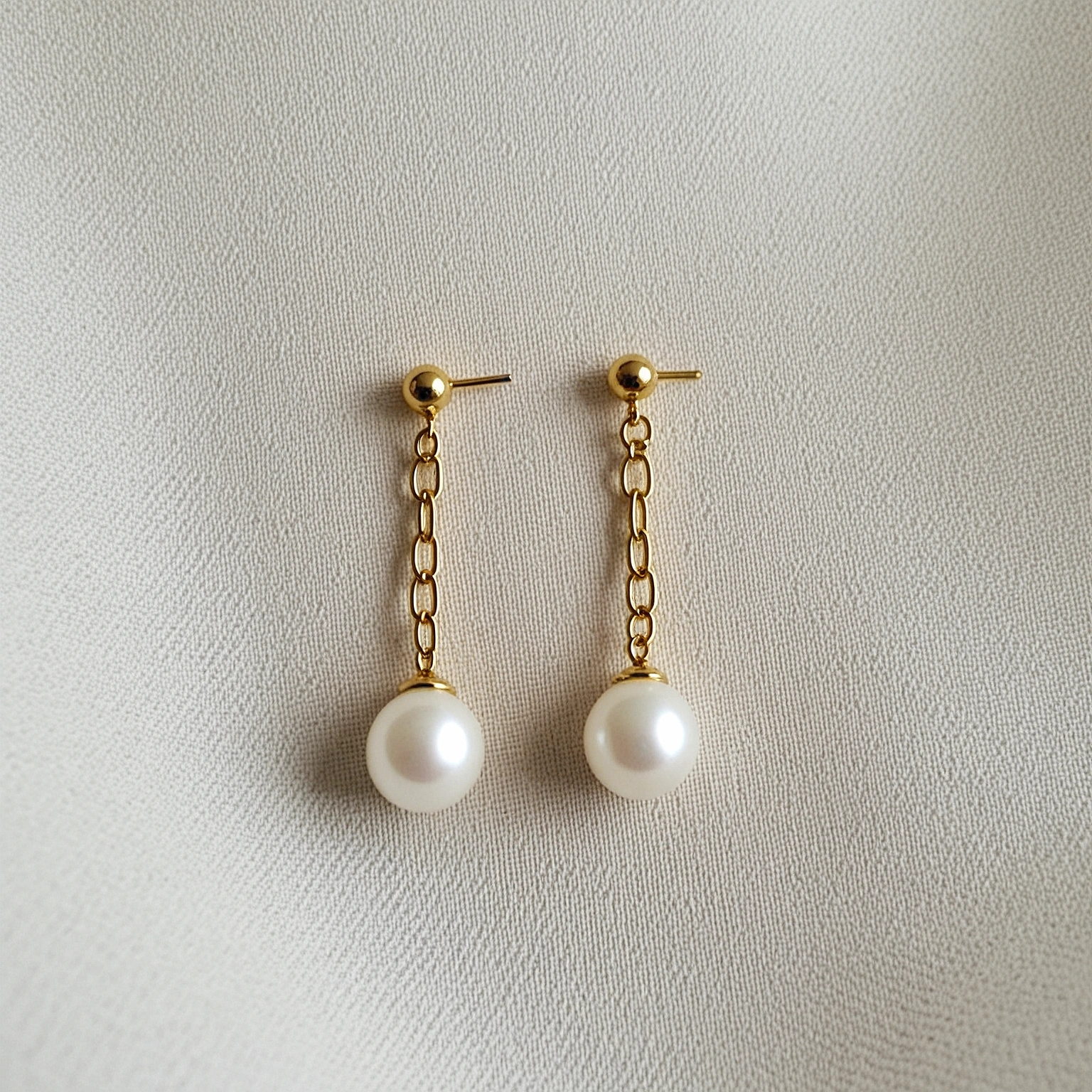 Rivenmark Pearl Drop Earrings — pair on ear